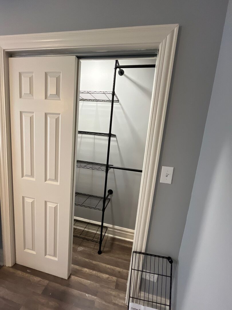 7438 South Champlain Avenue Chicago, IL 60619 - Photo 17 of 33 a view of staircase with white walls and a window