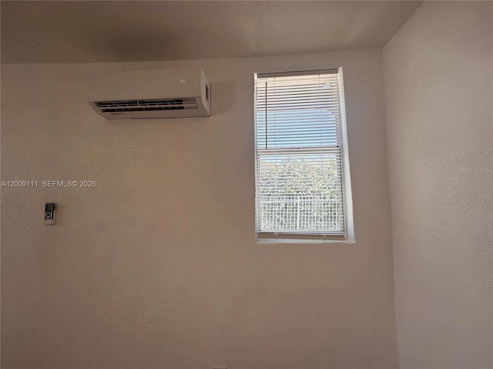 50 Northwest 79th Street, Unit 6 Miami, FL 33150 - Photo 14 of 30 a view of a window in an empty room
