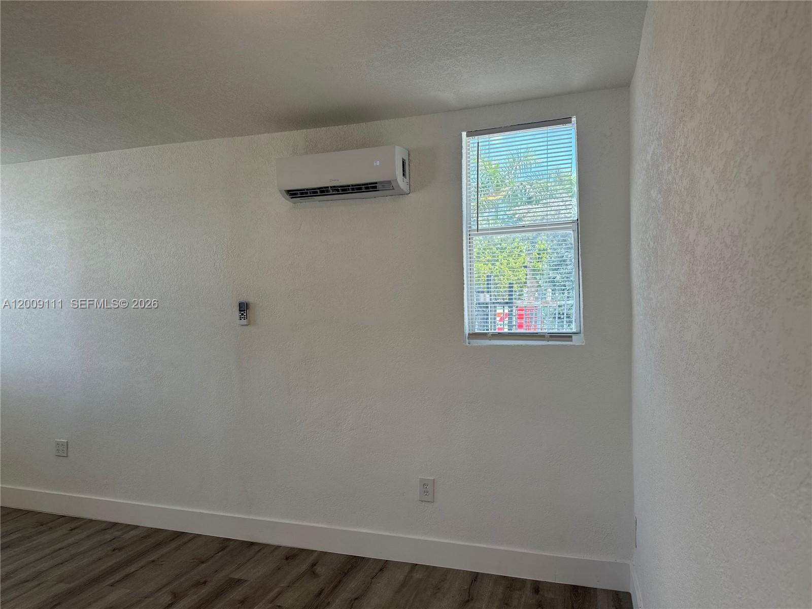 50 Northwest 79th Street, Unit 6 Miami, FL 33150 - Photo 22 of 30 an empty room with a window