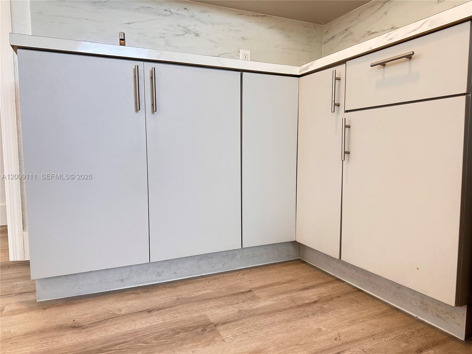 50 Northwest 79th Street, Unit 6 Miami, FL 33150 - Photo 28 of 30 a view of an empty room with wooden floor
