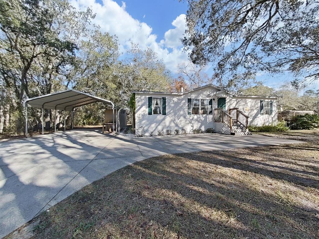 13255 Treaty Road Spring Hill, FL 34610 - Photo 1 of 1 a view of a town with barn house