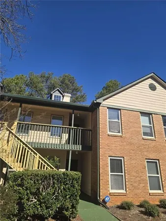 a front view of a house with a fence
