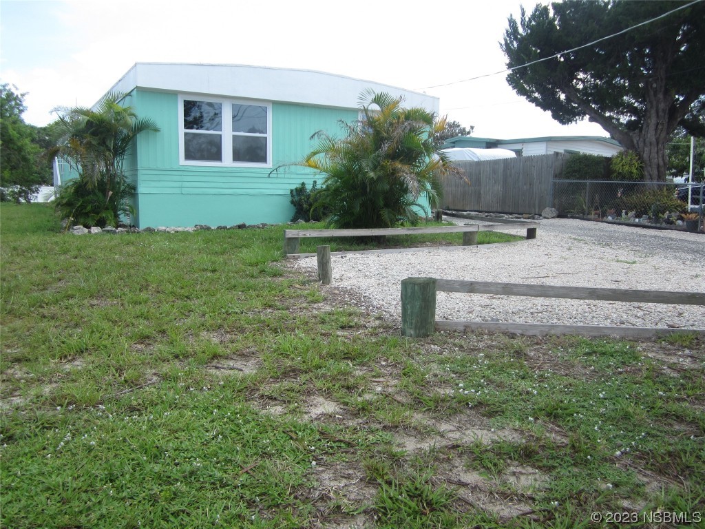 134 Douglas Street Edgewater, FL 32141 - Photo 20 of 27 a front view of a house with a yard