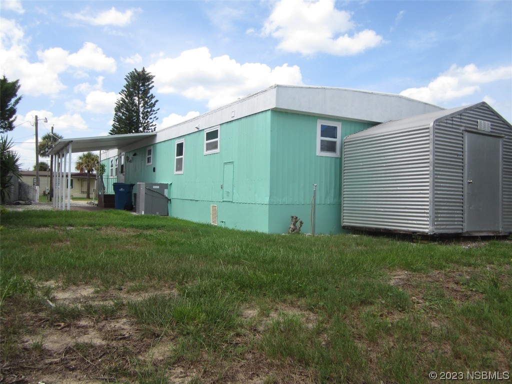 134 Douglas Street Edgewater, FL 32141 - Photo 22 of 27 a view of a backyard
