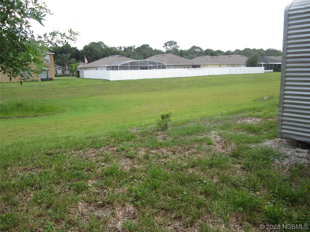 134 Douglas Street Edgewater, FL 32141 - Photo 24 of 27 a view of a lake with a city
