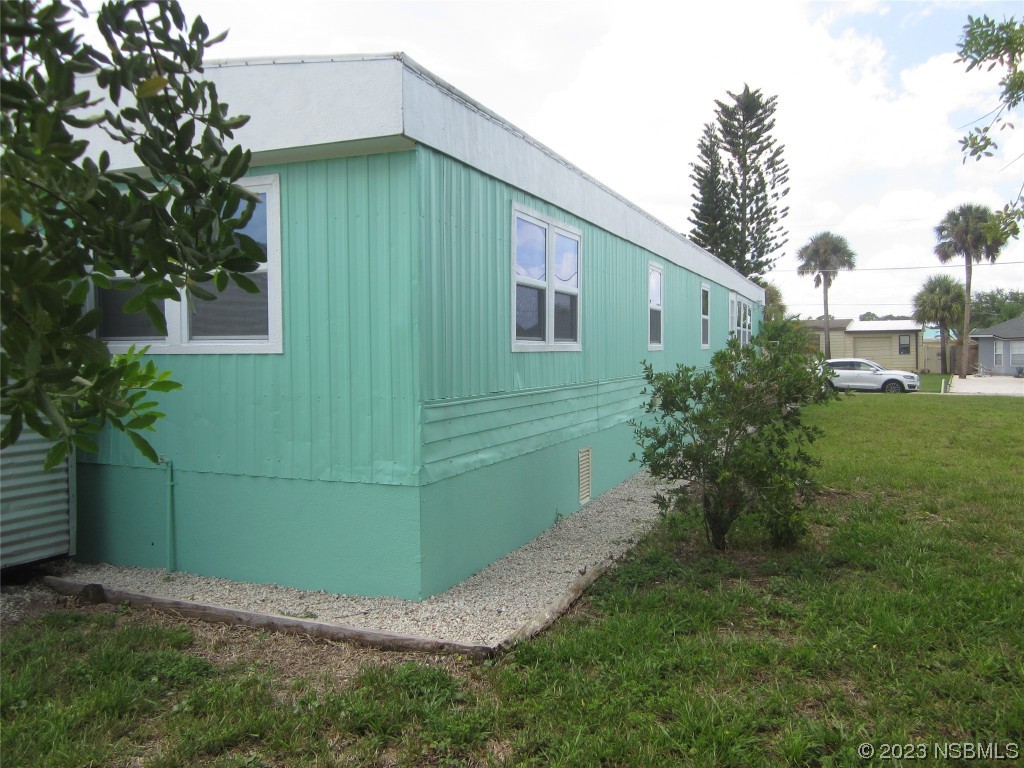 134 Douglas Street Edgewater, FL 32141 - Photo 26 of 27 a view of a backyard