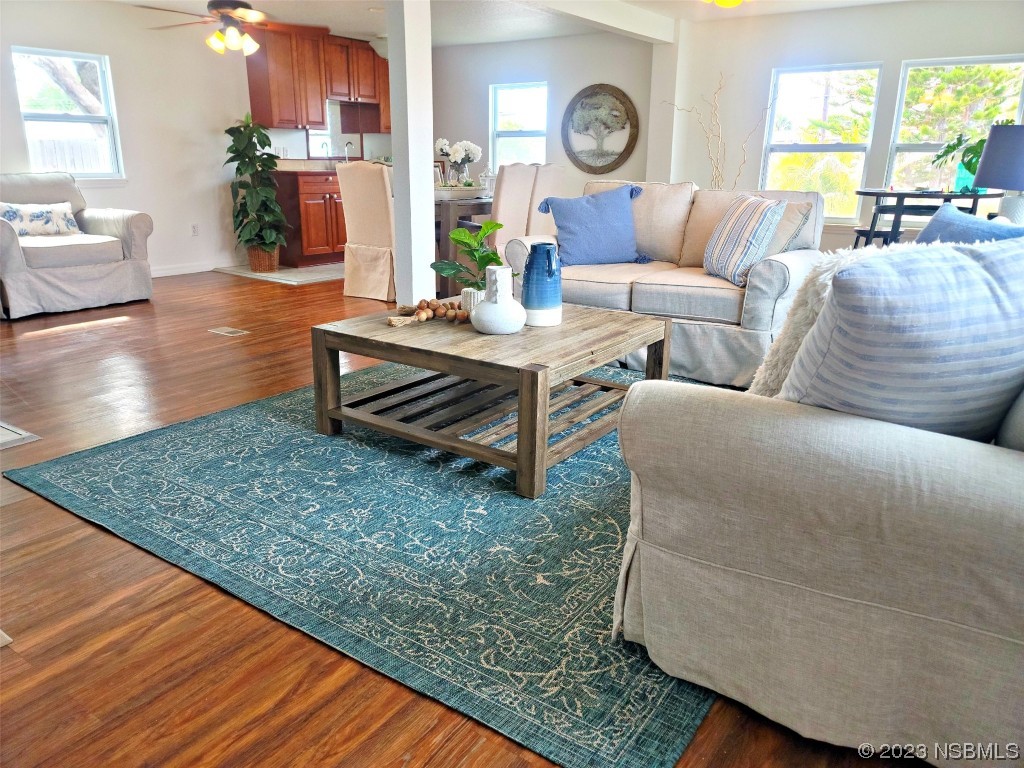 134 Douglas Street Edgewater, FL 32141 - Photo 3 of 27 a living room with furniture and wooden floor