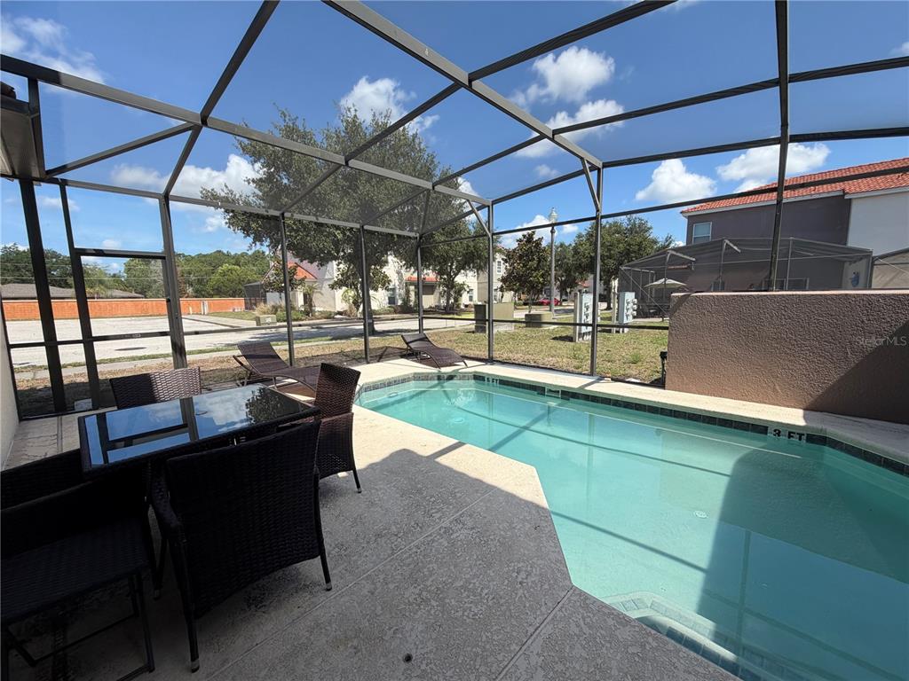 4573 Ada Lane Kissimmee, FL 34746 - Photo 23 of 37 a view of a chairs and table in a patio
