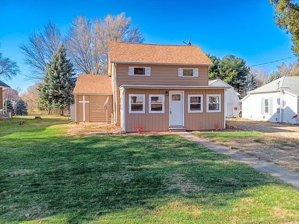 a front view of a house with a yard