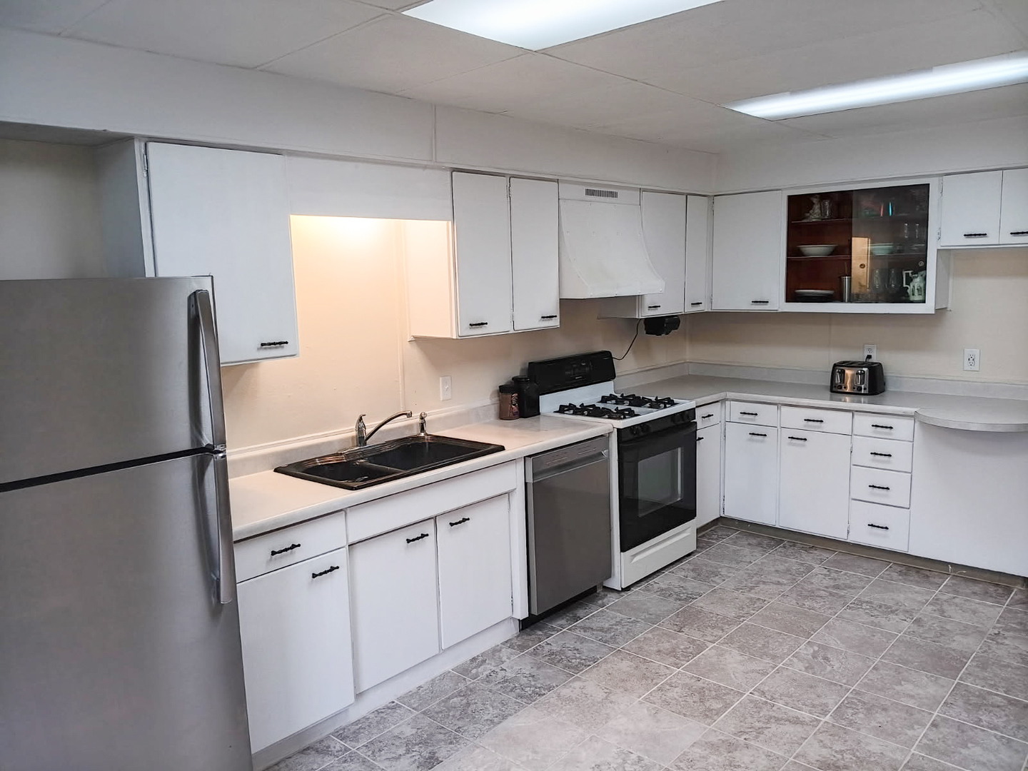 203 North Main Coleta, IL 61081 - Photo 11 of 36 a kitchen with white cabinets sink and white appliances