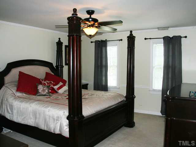 2405 Trellis Court Raleigh, NC 27616 - Photo 15 of 23 Cozy yet spacious, the master bedroom has twin separate closets, well-spaced.