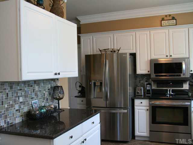 2405 Trellis Court Raleigh, NC 27616 - Photo 4 of 23 There's plenty of cabinet space in this well-laid-out kitchen with top-quality appliances.