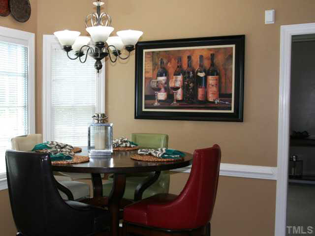 2405 Trellis Court Raleigh, NC 27616 - Photo 8 of 23 Welcome the family each morning to sun and color, by the bay window in the breakfast room. The perfect party space, between kitchen and living room.