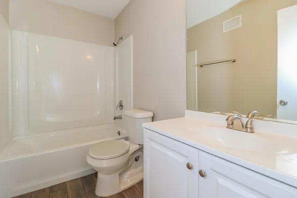 a bathroom with a sink a toilet and a bathtub