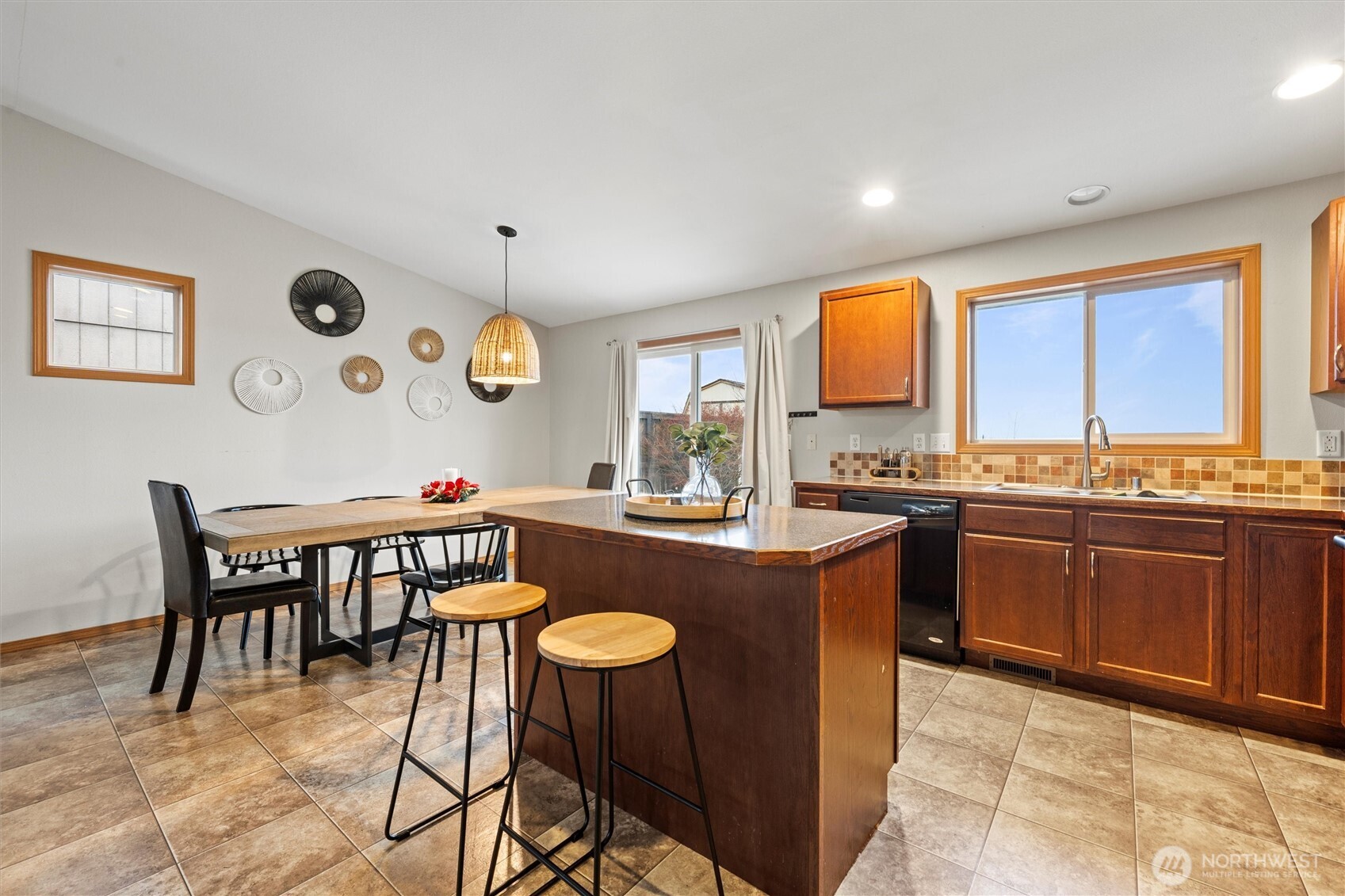 682 L Street Southeast Ephrata, WA 98823 - Photo 14 of 40 a kitchen with a table chairs sink and cabinets