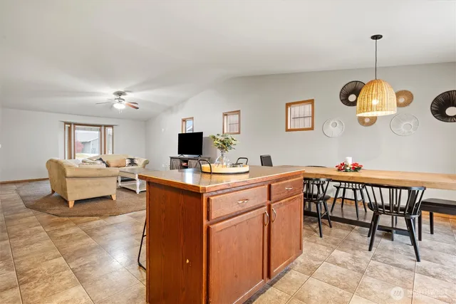 a kitchen with a dining table and chairs
