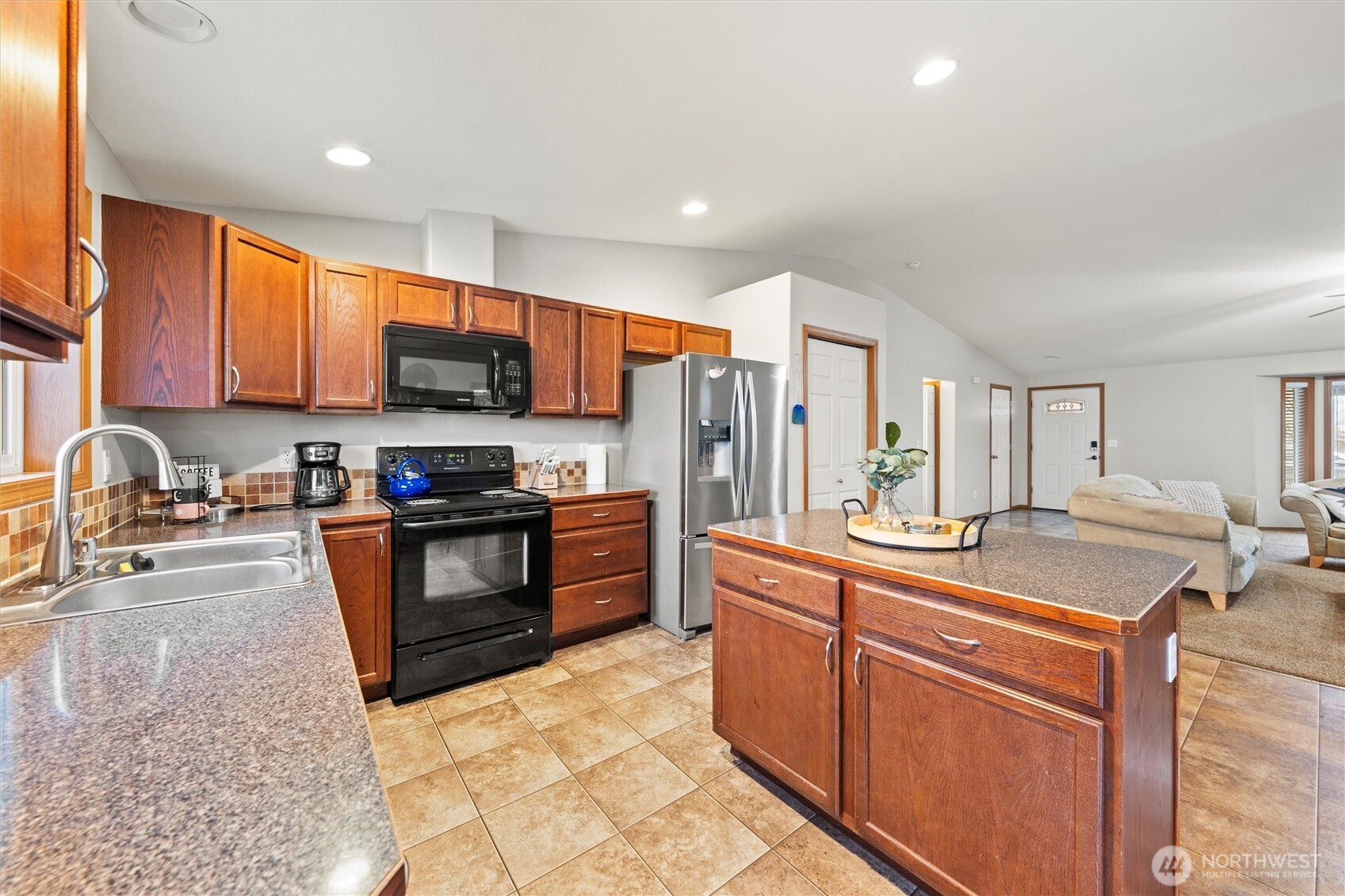 682 L Street Southeast Ephrata, WA 98823 - Photo 18 of 40 a kitchen with stainless steel appliances granite countertop a stove a sink dishwasher a refrigerator and a microwave