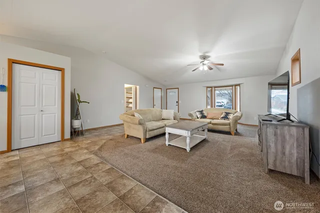 a living room with furniture and a window
