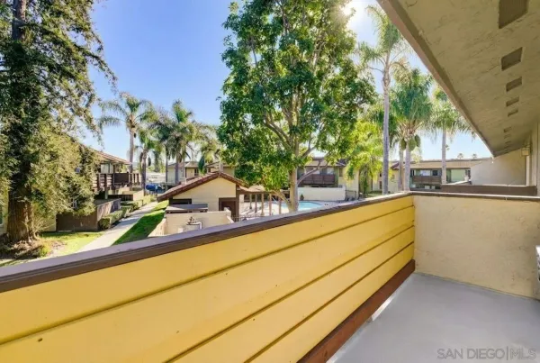 a view of swimming pool with outdoor seating and yard