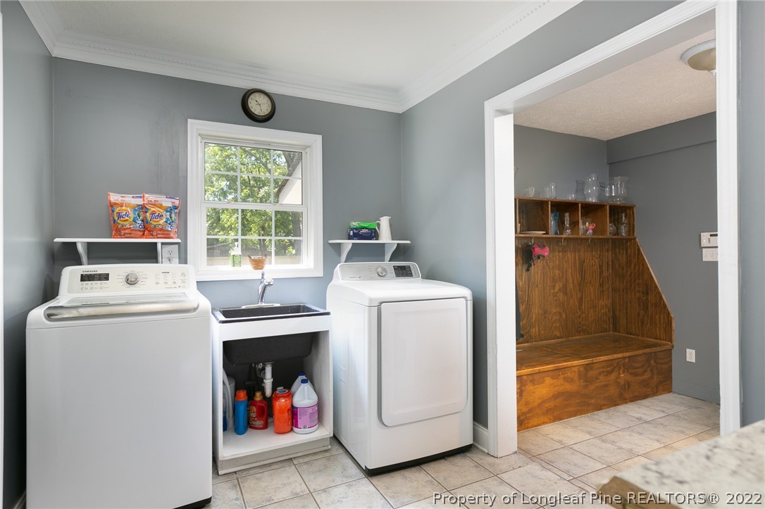 5016 J T Matthews Road Godwin, NC 28344 - Photo 15 of 50 a utility room with dryer and washer