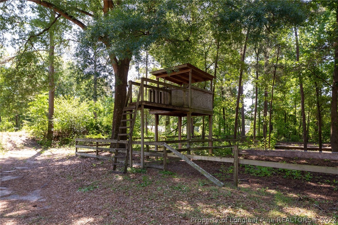 5016 J T Matthews Road Godwin, NC 28344 - Photo 46 of 50 a view of a house with a yard