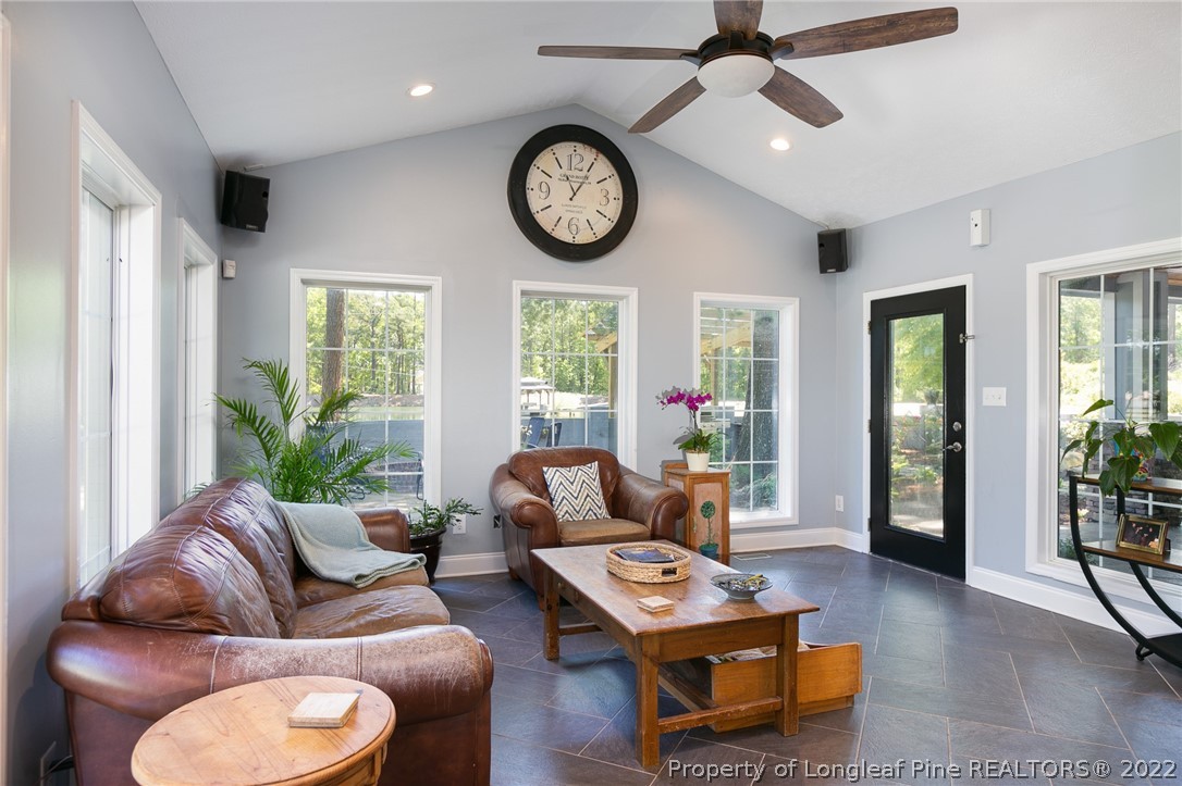 5016 J T Matthews Road Godwin, NC 28344 - Photo 8 of 50 a living room with furniture a clock and a window