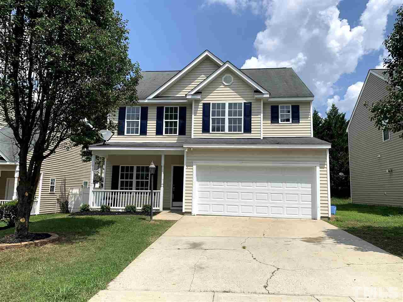 1929 Red Quartz Drive Raleigh, NC 27610 - Photo 1 of 12 new garage door, fresh paint on shutters and patio.