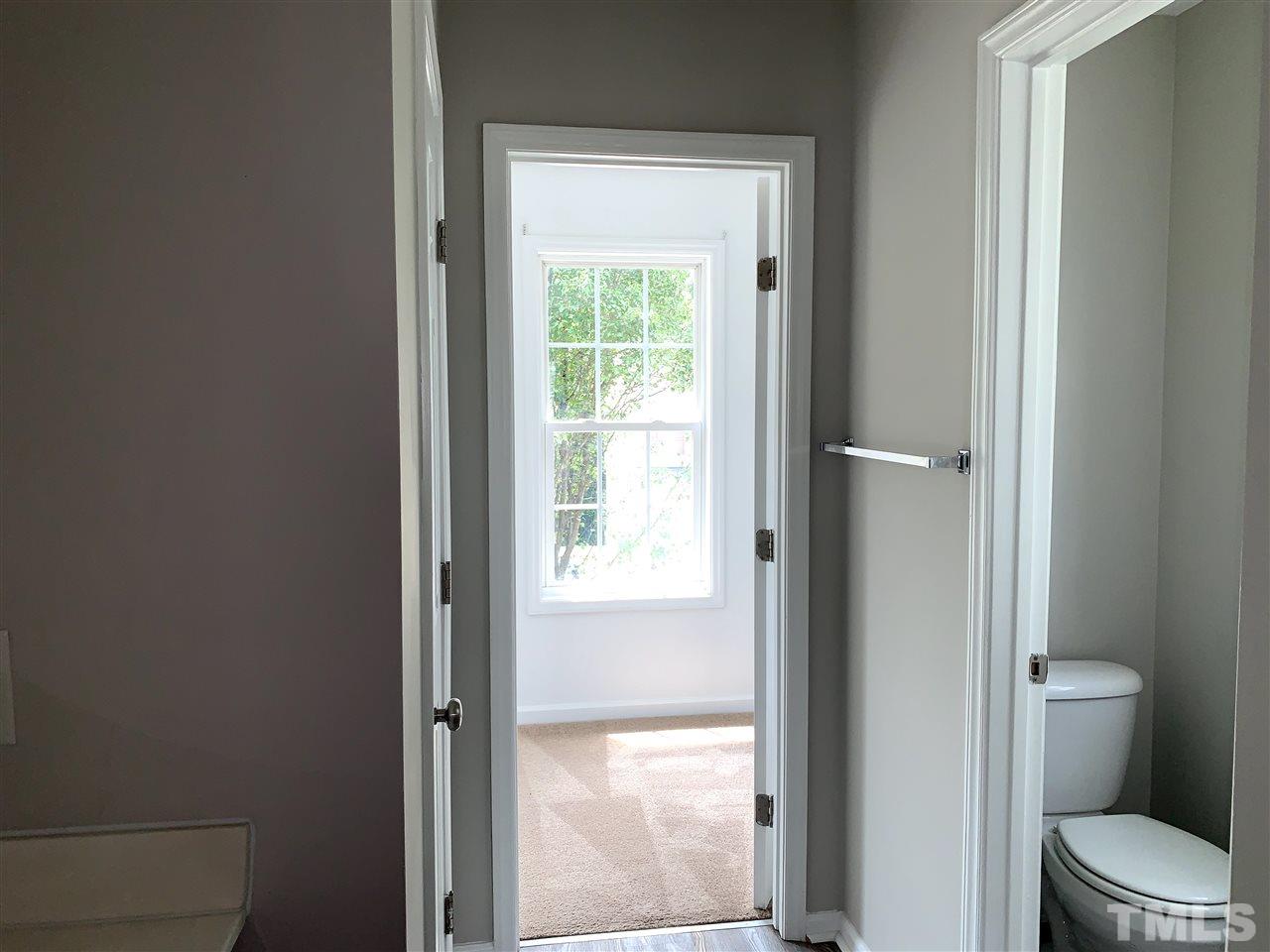 1929 Red Quartz Drive Raleigh, NC 27610 - Photo 12 of 12 large walk in closet with window. Separate toilet room for privacy. linen closet on other side.