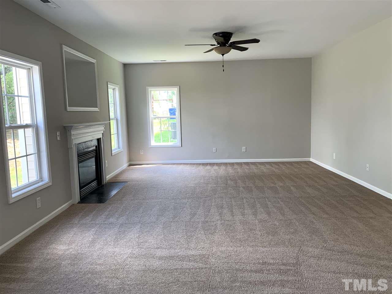 1929 Red Quartz Drive Raleigh, NC 27610 - Photo 5 of 12 very high ceilings with lots of light. gas fireplace may not work; will not be fixed.