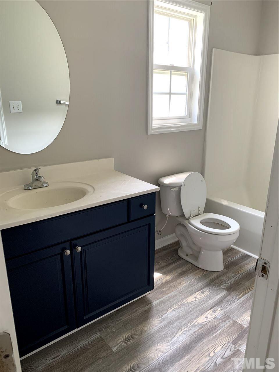 1929 Red Quartz Drive Raleigh, NC 27610 - Photo 8 of 12 large bathroom with tub/shower combo. new luxury vinyl plank floors and new fixtures.