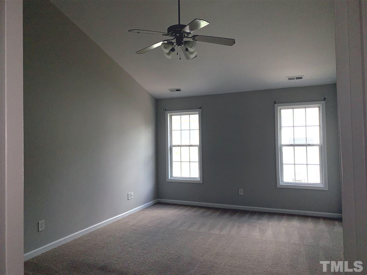 1929 Red Quartz Drive Raleigh, NC 27610 - Photo 10 of 12 large master with vaulted ceilings, large bathroom with walk in closet and dual vanity sinks.