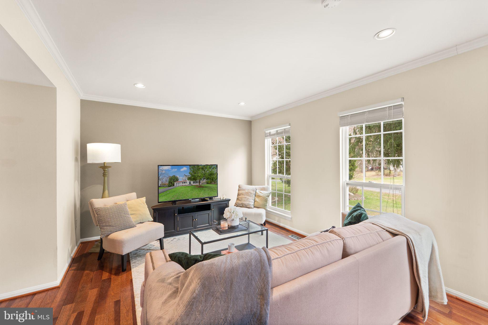2412 Ivywood Road Reston, VA 20191 - Photo 11 of 63 a living room with furniture and a flat screen tv