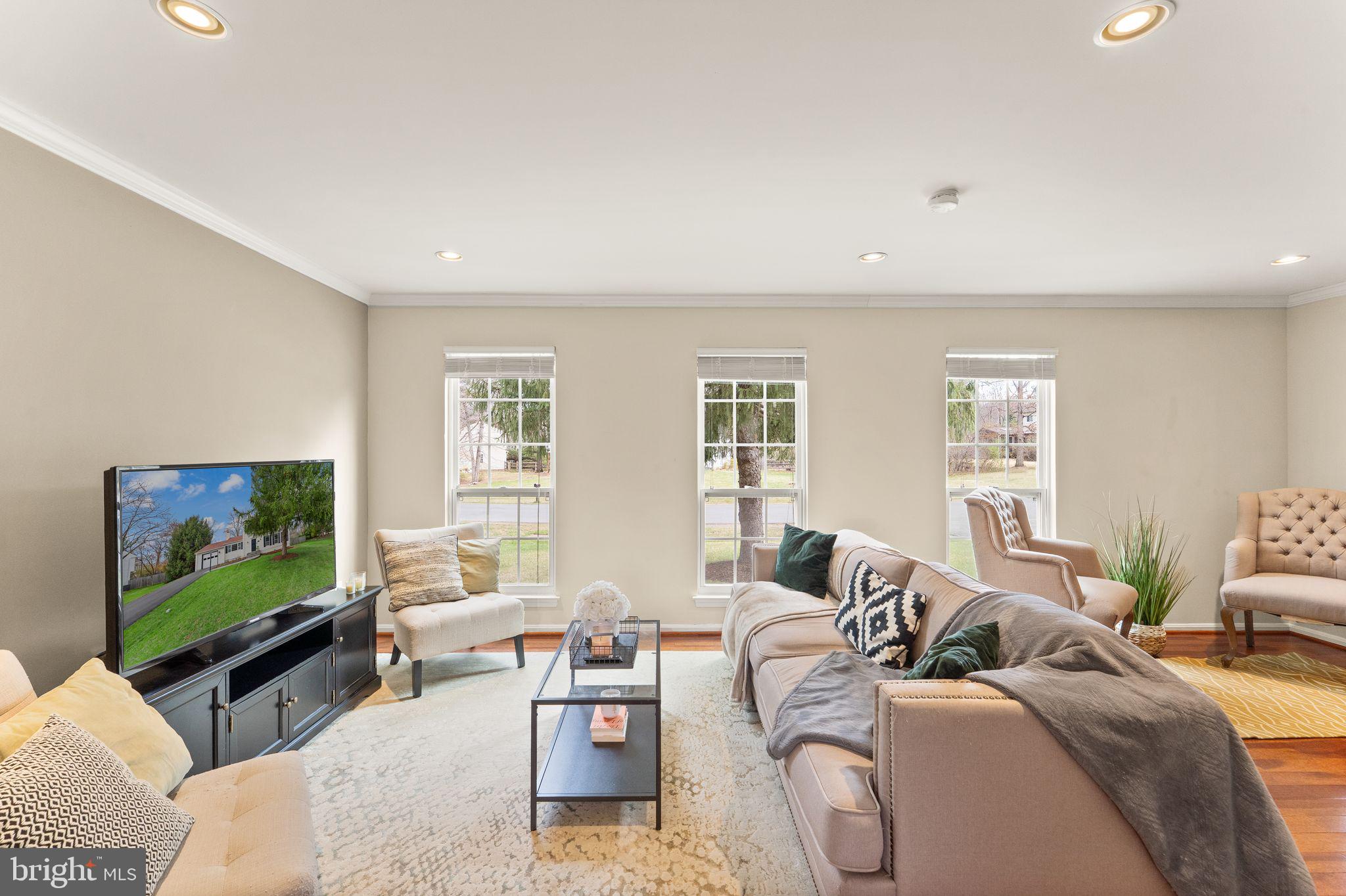2412 Ivywood Road Reston, VA 20191 - Photo 12 of 63 a living room with furniture a flat screen tv and a window