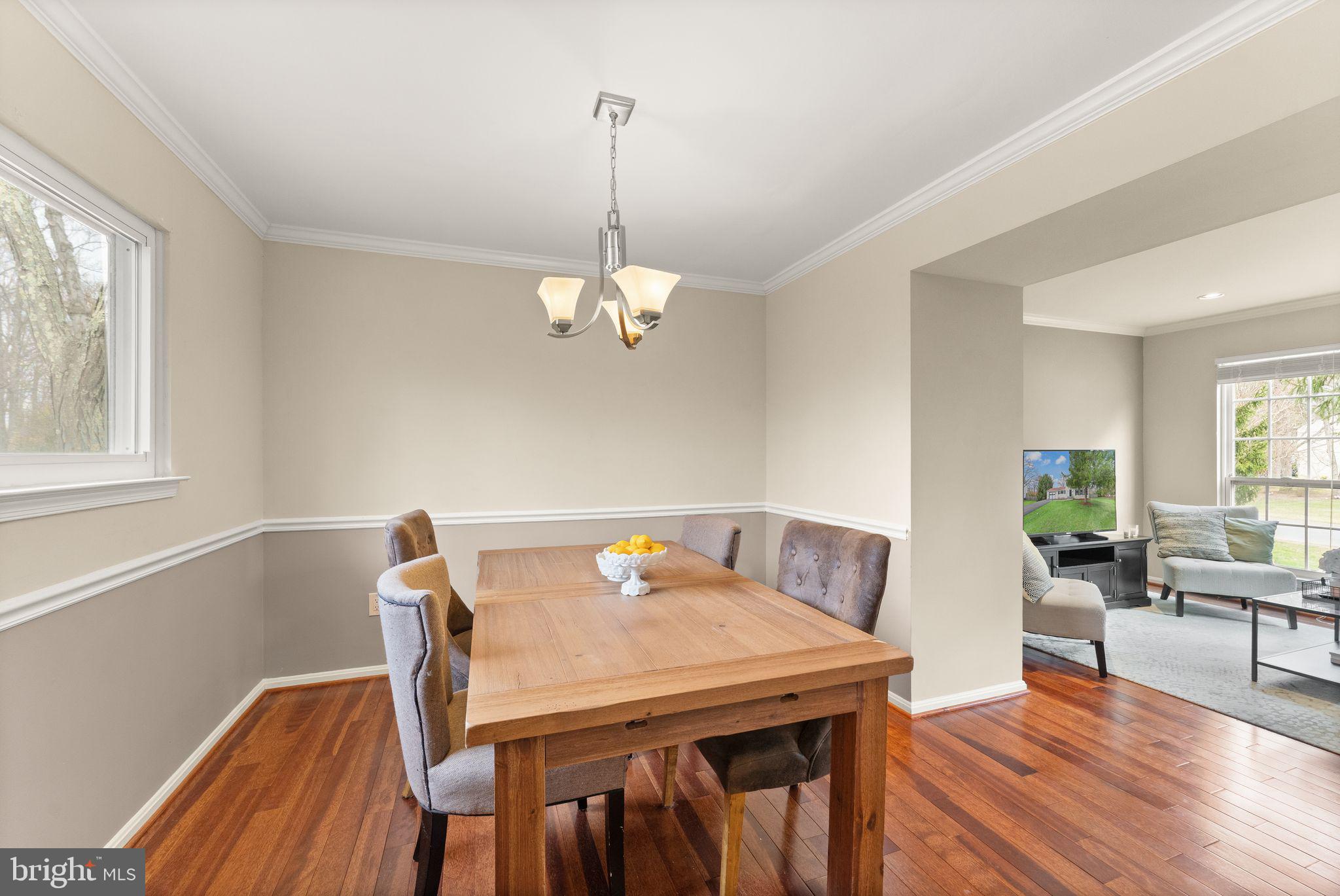 2412 Ivywood Road Reston, VA 20191 - Photo 14 of 63 a view of a dining room with furniture wooden floor and chandelier