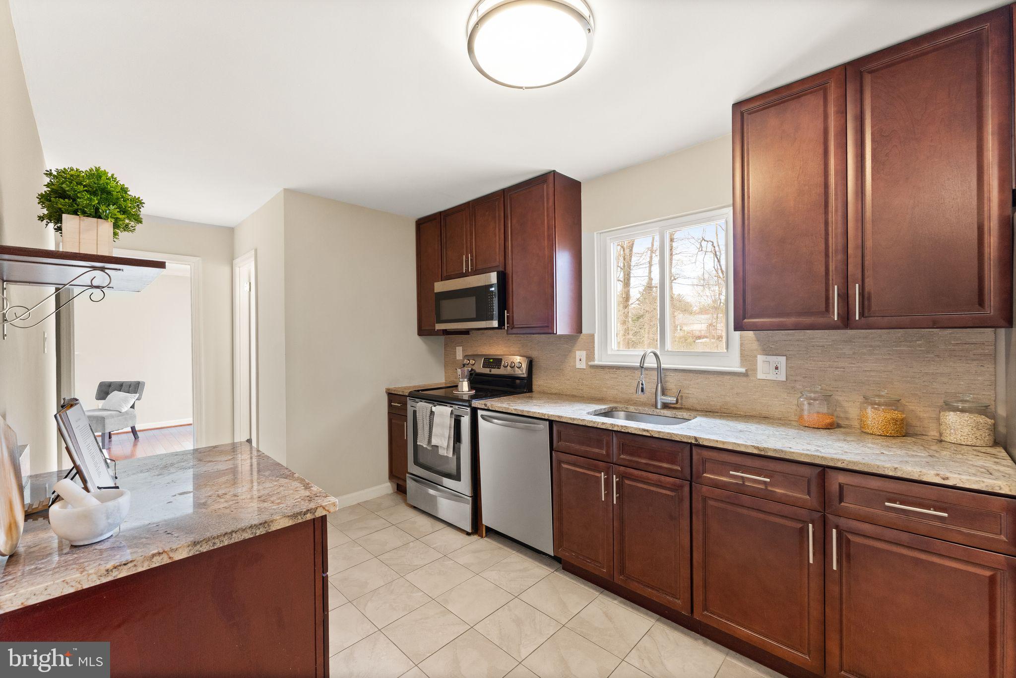 2412 Ivywood Road Reston, VA 20191 - Photo 17 of 63 a kitchen with a sink cabinets and window