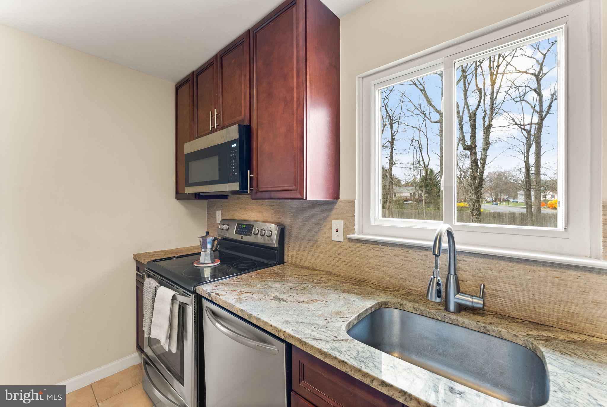 2412 Ivywood Road Reston, VA 20191 - Photo 18 of 63 a kitchen with a sink and a window