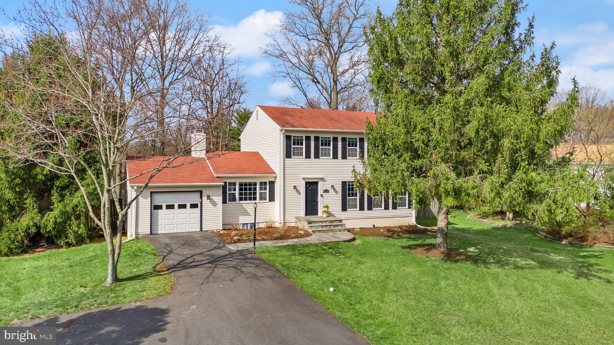 2412 Ivywood Road Reston, VA 20191 - Photo 2 of 63 a front view of a house with a yard