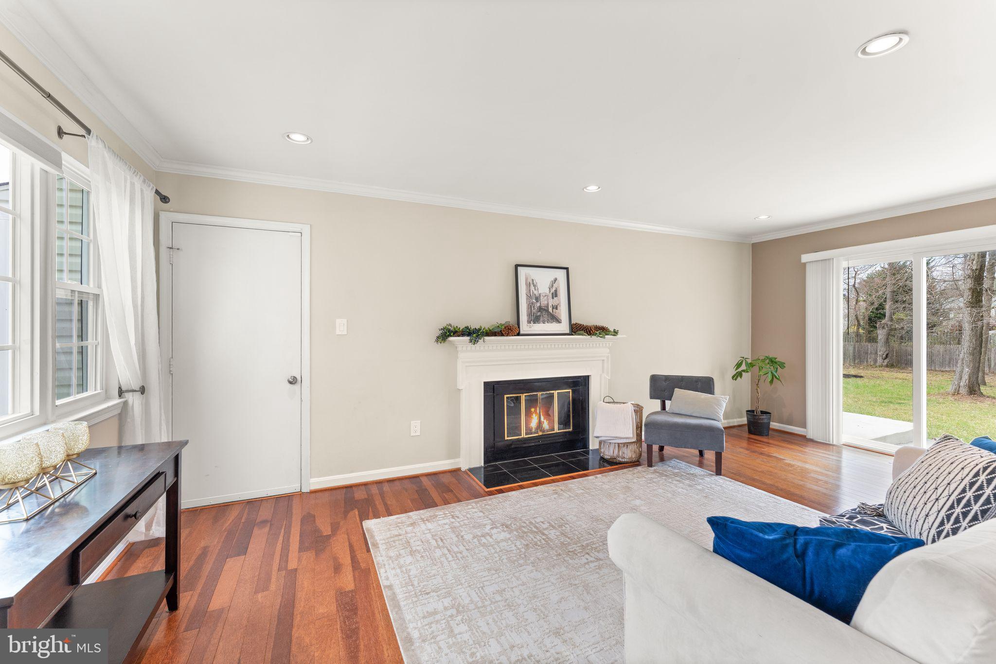 2412 Ivywood Road Reston, VA 20191 - Photo 21 of 63 a living room with furniture and a fireplace