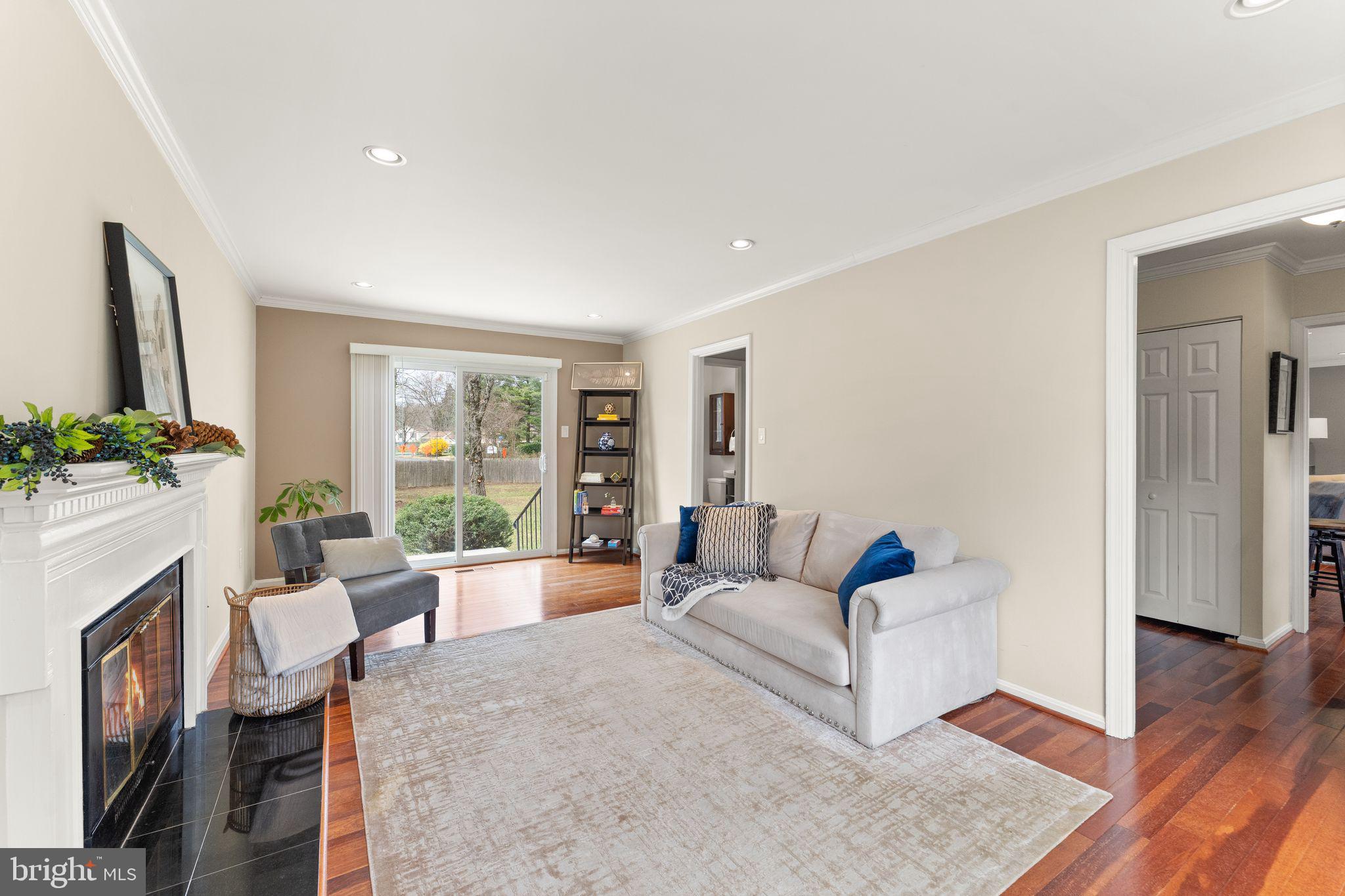 2412 Ivywood Road Reston, VA 20191 - Photo 22 of 63 a living room with fireplace furniture and a wooden floor