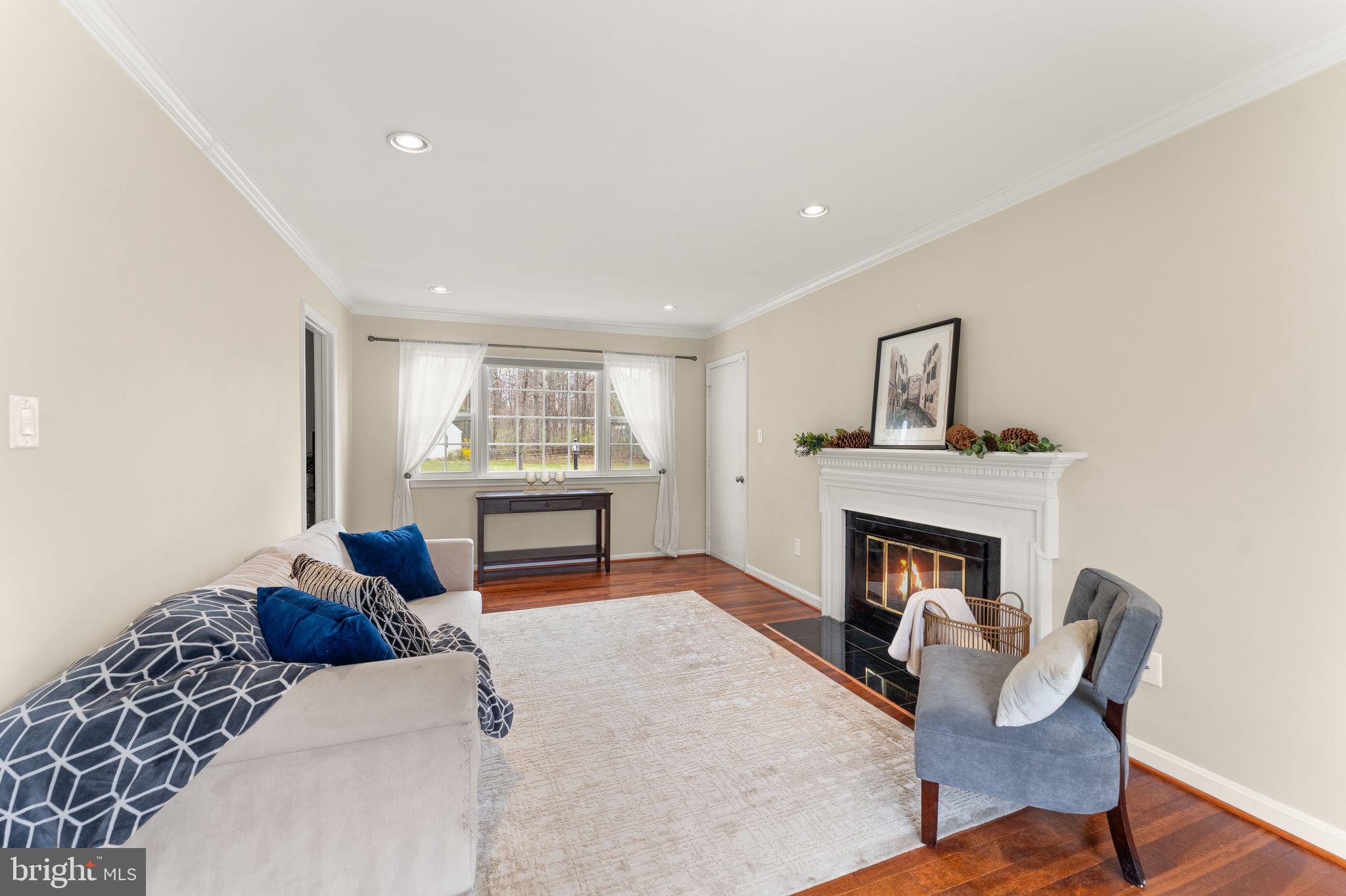 2412 Ivywood Road Reston, VA 20191 - Photo 23 of 63 a living room with furniture and a fireplace