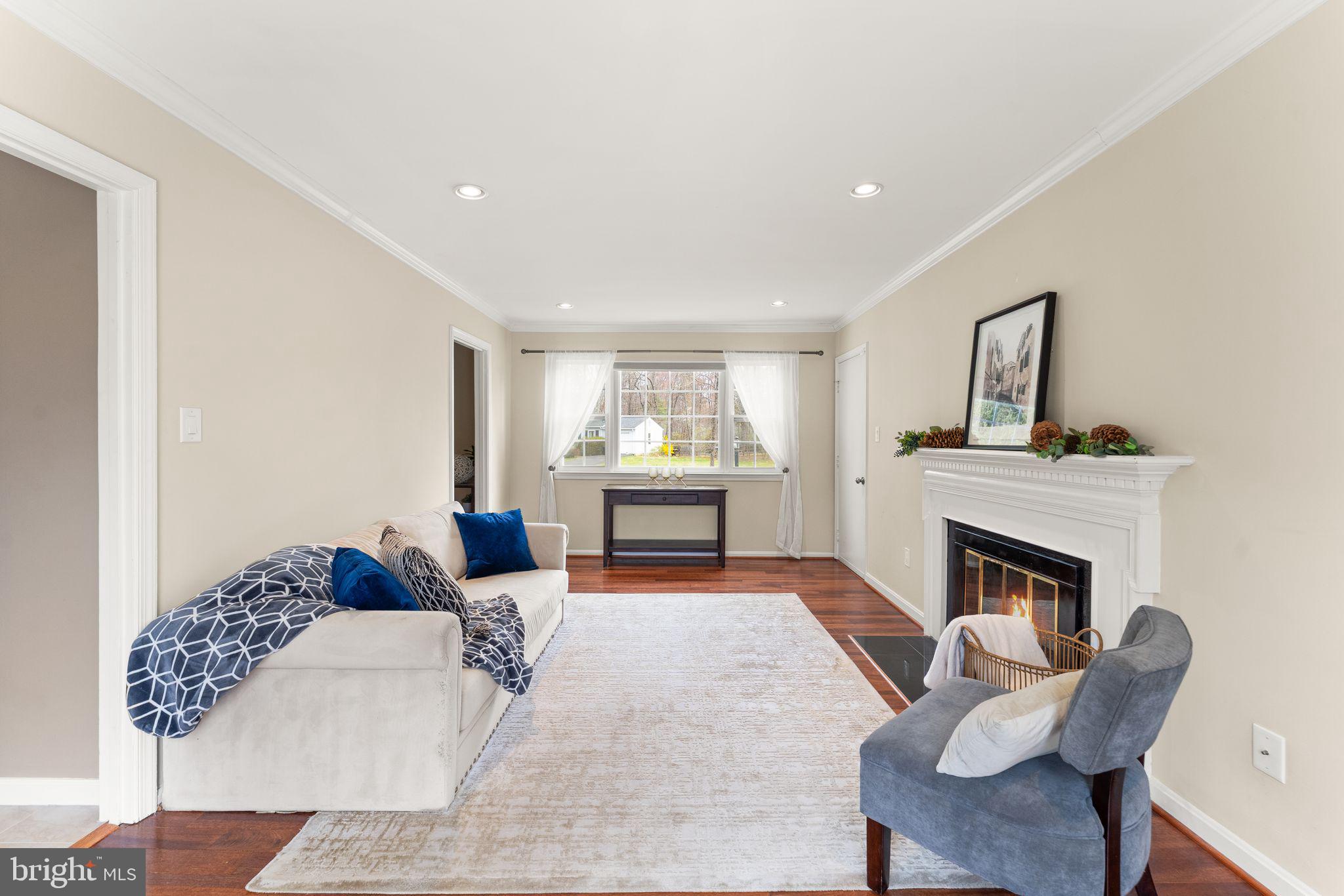 2412 Ivywood Road Reston, VA 20191 - Photo 24 of 63 a living room with furniture and a fireplace