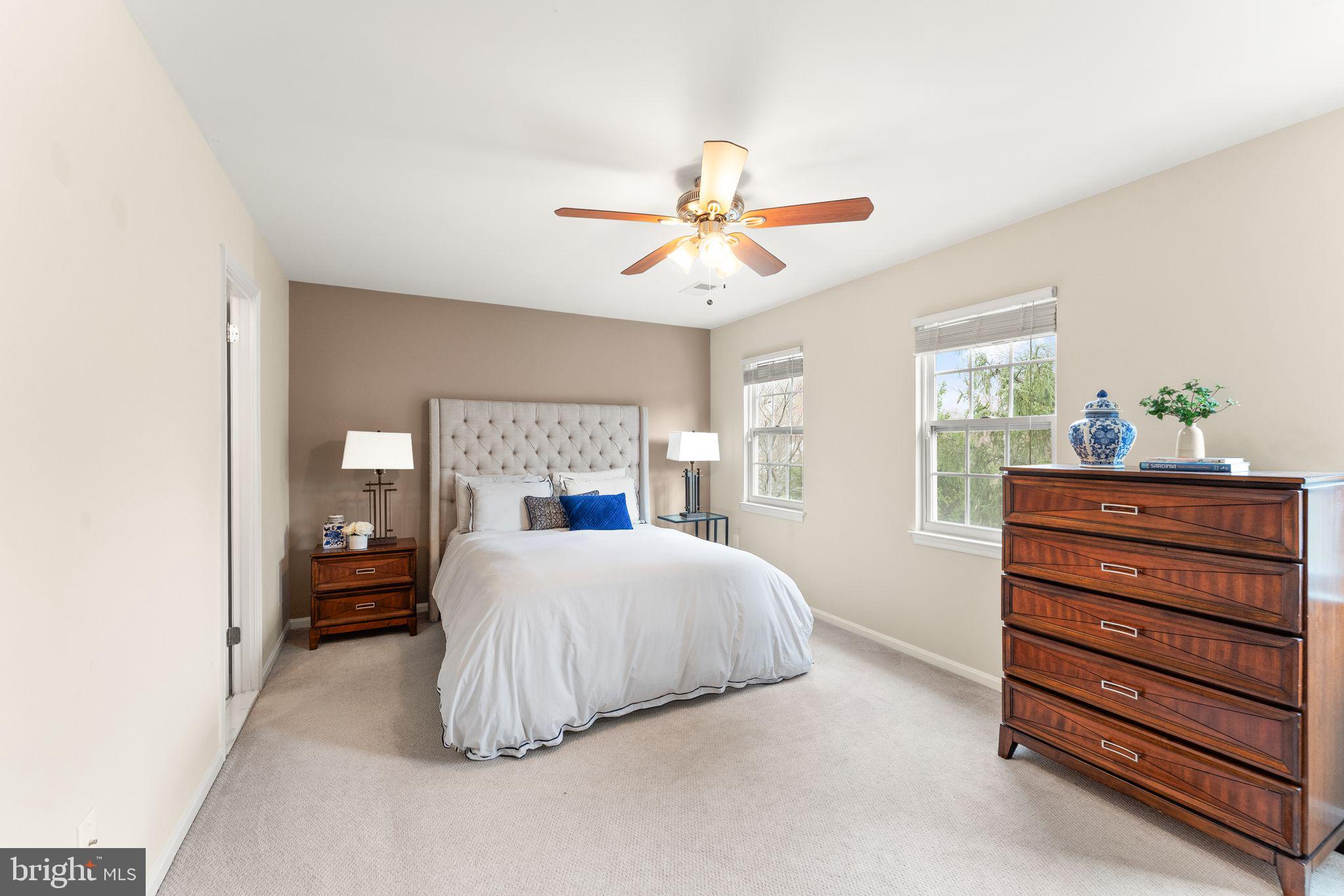 2412 Ivywood Road Reston, VA 20191 - Photo 26 of 63 a bedroom with a bed and a chandelier