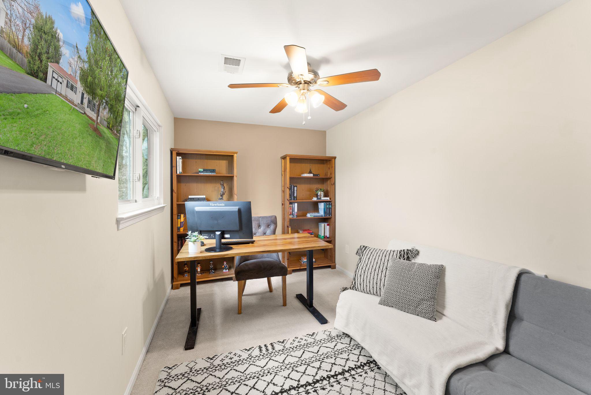 2412 Ivywood Road Reston, VA 20191 - Photo 34 of 63 a living room with furniture and a chandelier
