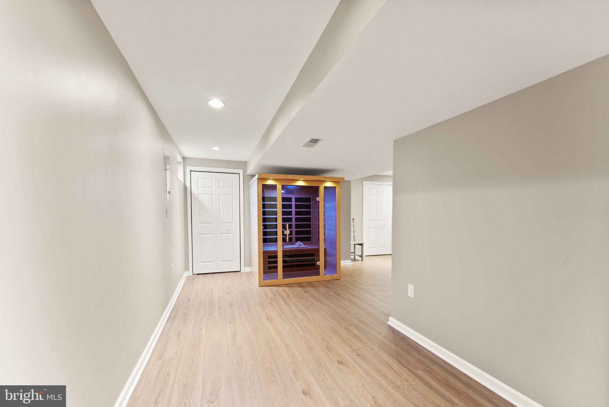 2412 Ivywood Road Reston, VA 20191 - Photo 44 of 63 an empty room with wooden floor closet and windows