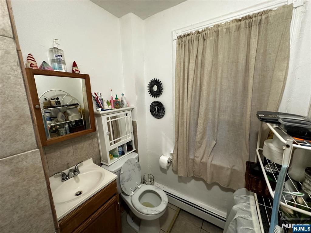 366 Summer Avenue Newark, NJ 07104 - Photo 13 of 22 a bathroom with a sink a toilet and shower