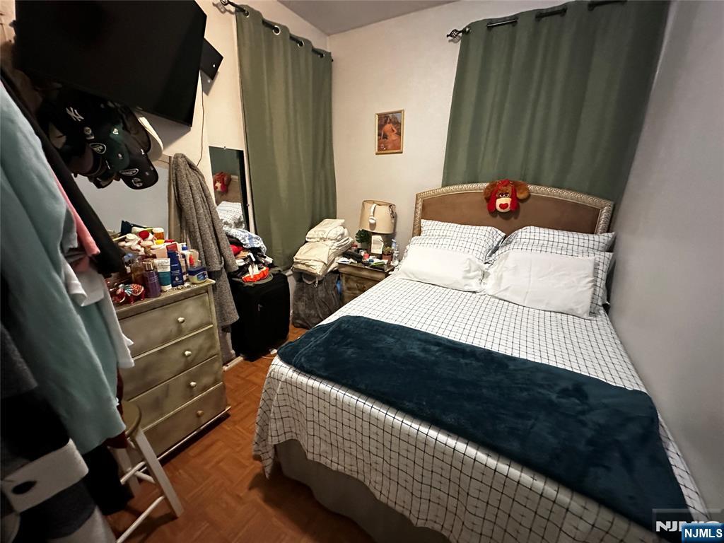 366 Summer Avenue Newark, NJ 07104 - Photo 10 of 22 a bedroom with a bed dresser and a window