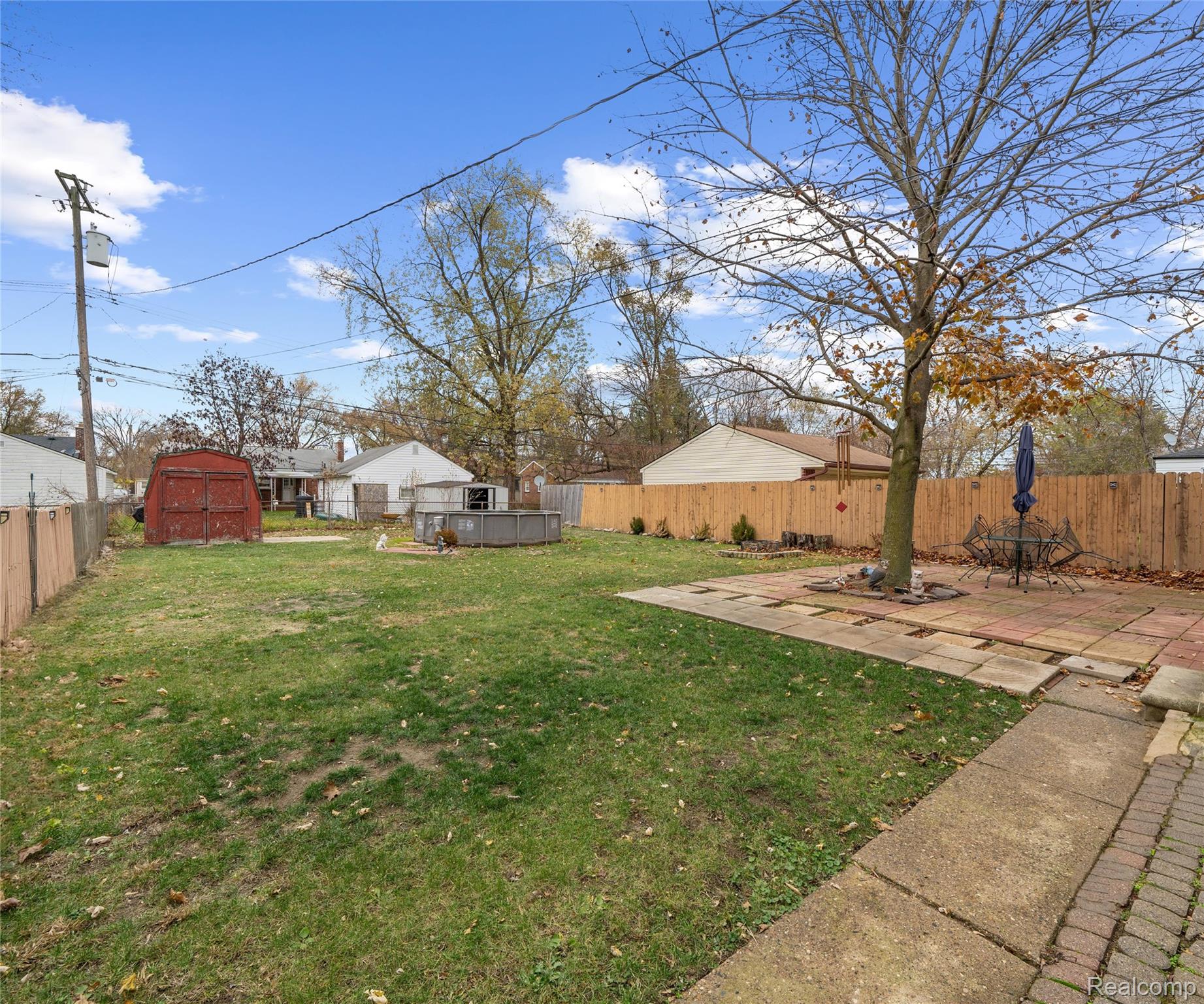 28940 Grandview Street Inkster, MI 48141 - Photo 34 of 41 Fenced backyard featuring a patio area and a shed