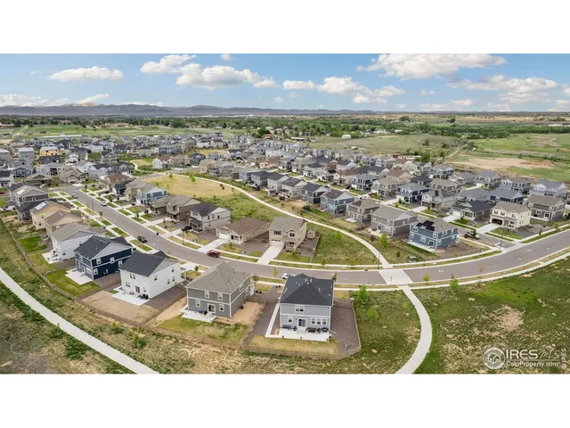 an aerial view of a house with roof deck