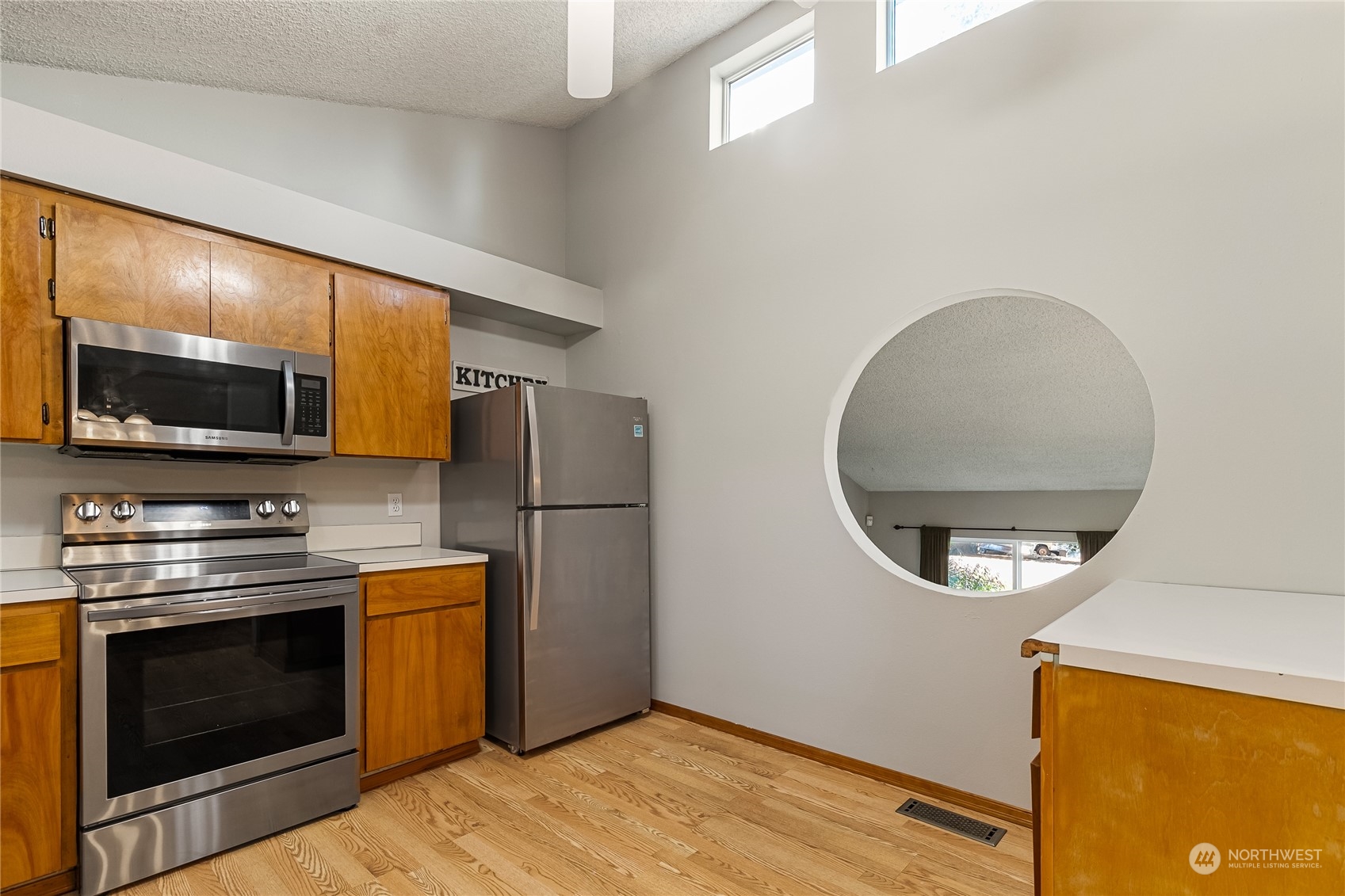 5917 Longdin Road Ferndale, WA 98248 - Photo 13 of 36 a kitchen with stainless steel appliances a stove a microwave a refrigerator and a microwave