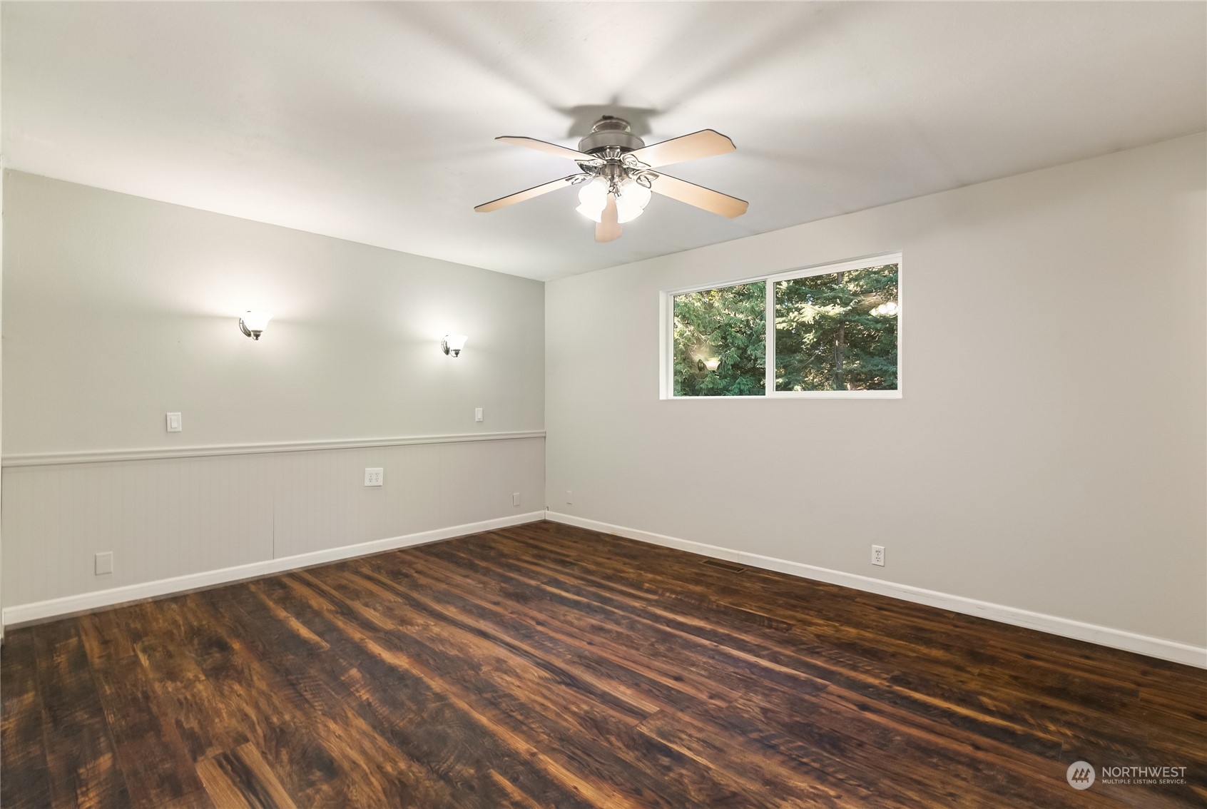 5917 Longdin Road Ferndale, WA 98248 - Photo 15 of 36 an empty room with wooden floor fan and windows
